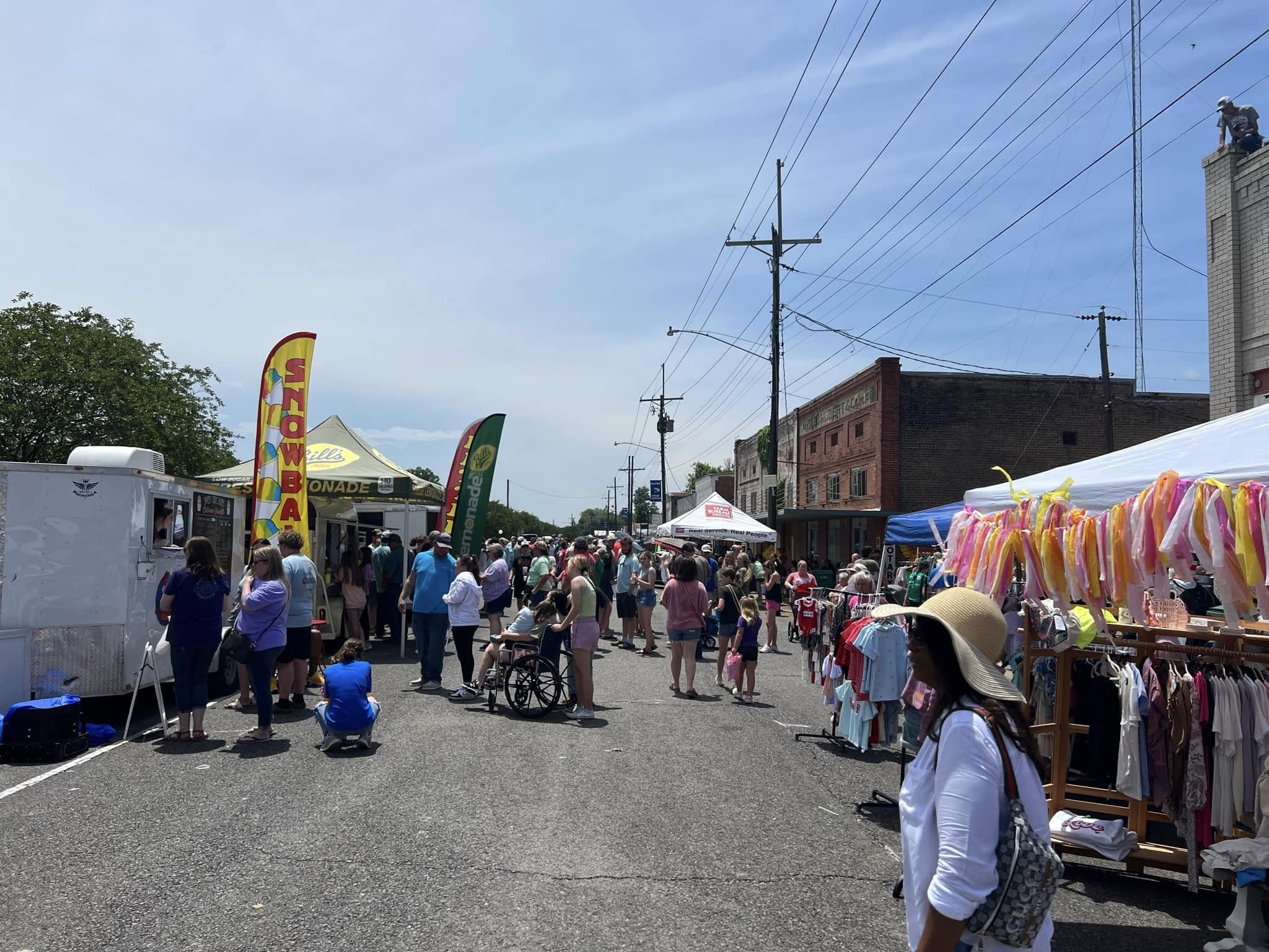 Vendors and shoppers lining Main Street