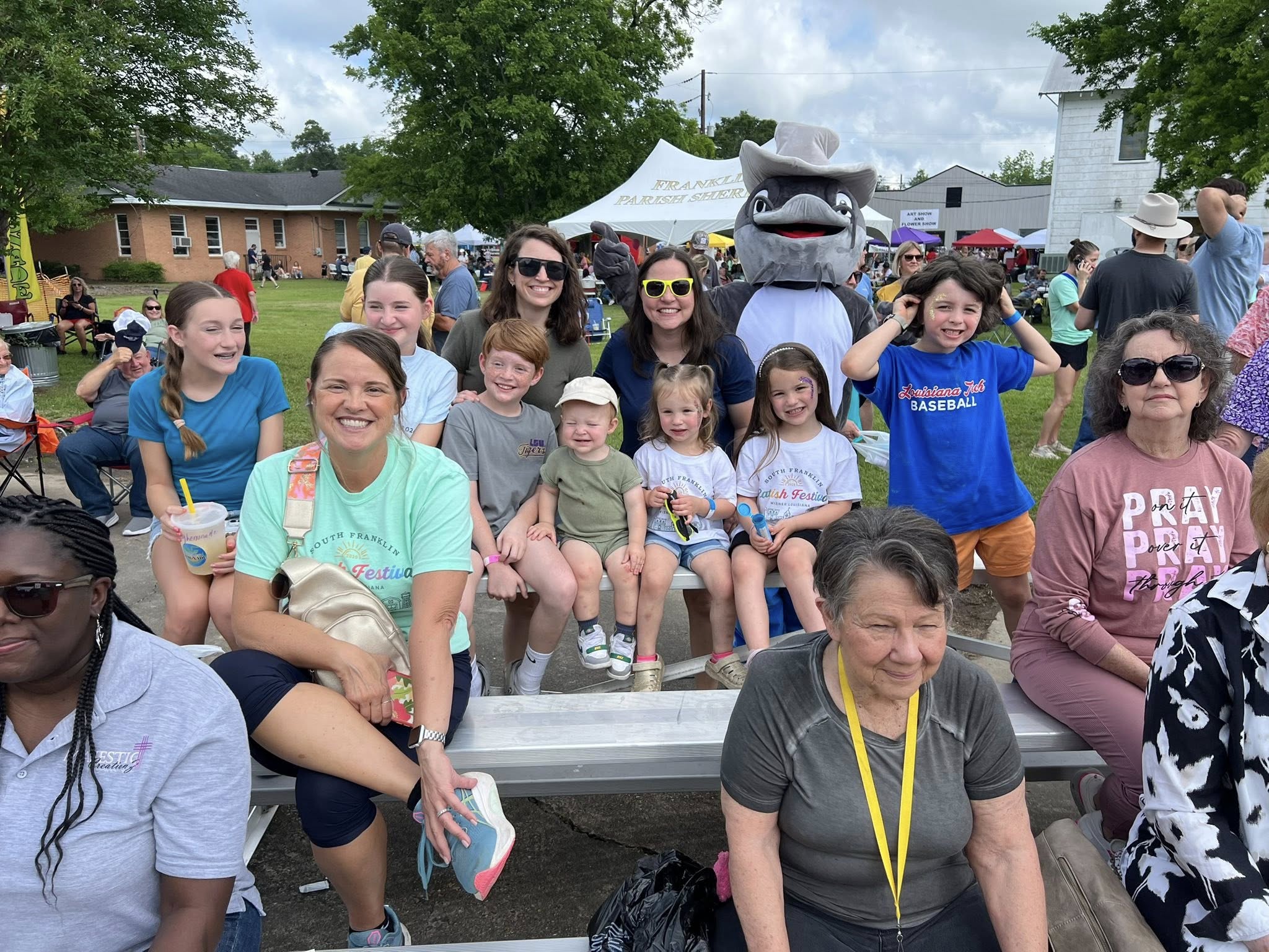 Festival families with the catfish mascot