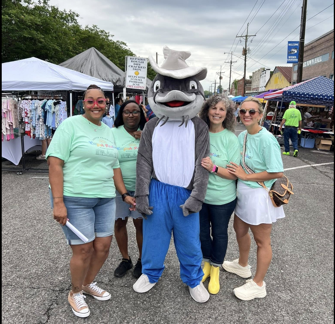 Volunteers with the catfish mascot on Main Street